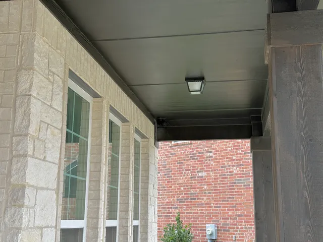 Covered patio with a security camera beneath the roof