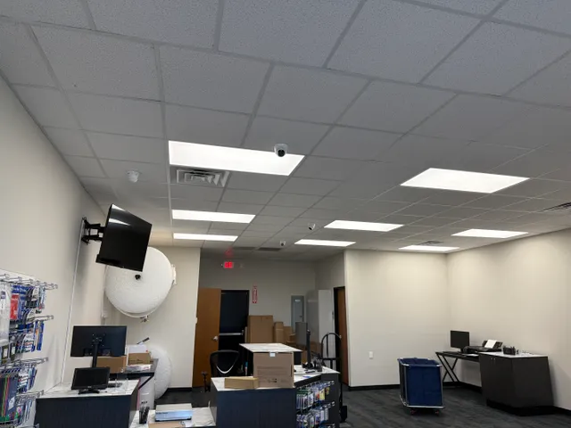 Camera mounted in the ceiling of a business interior